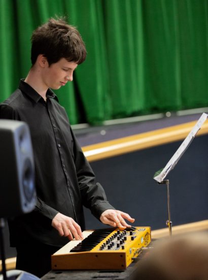 Picture of Ben playing the keyboards