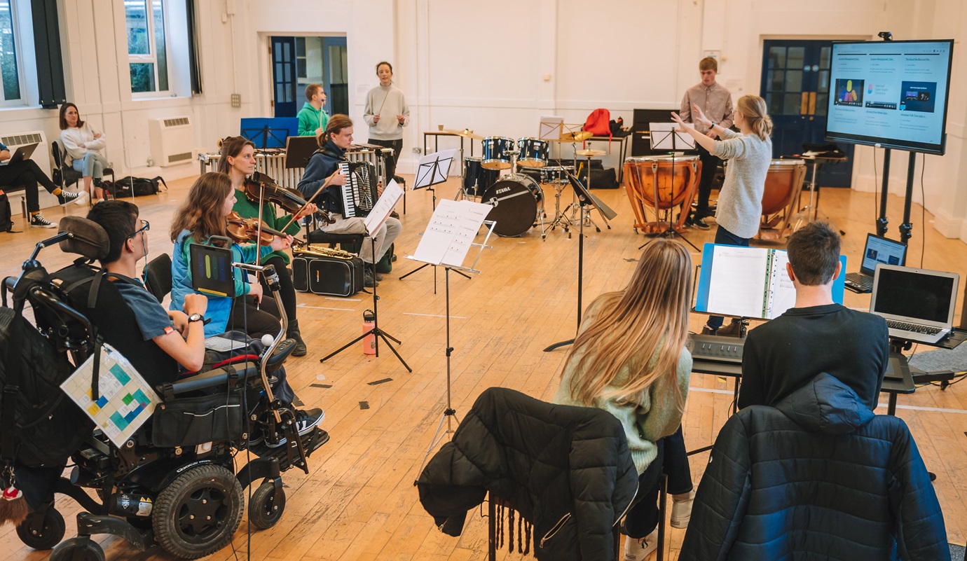 NOYO Bristol Ensemble rehearsal showing musicians playing acoustic and electronic instruments