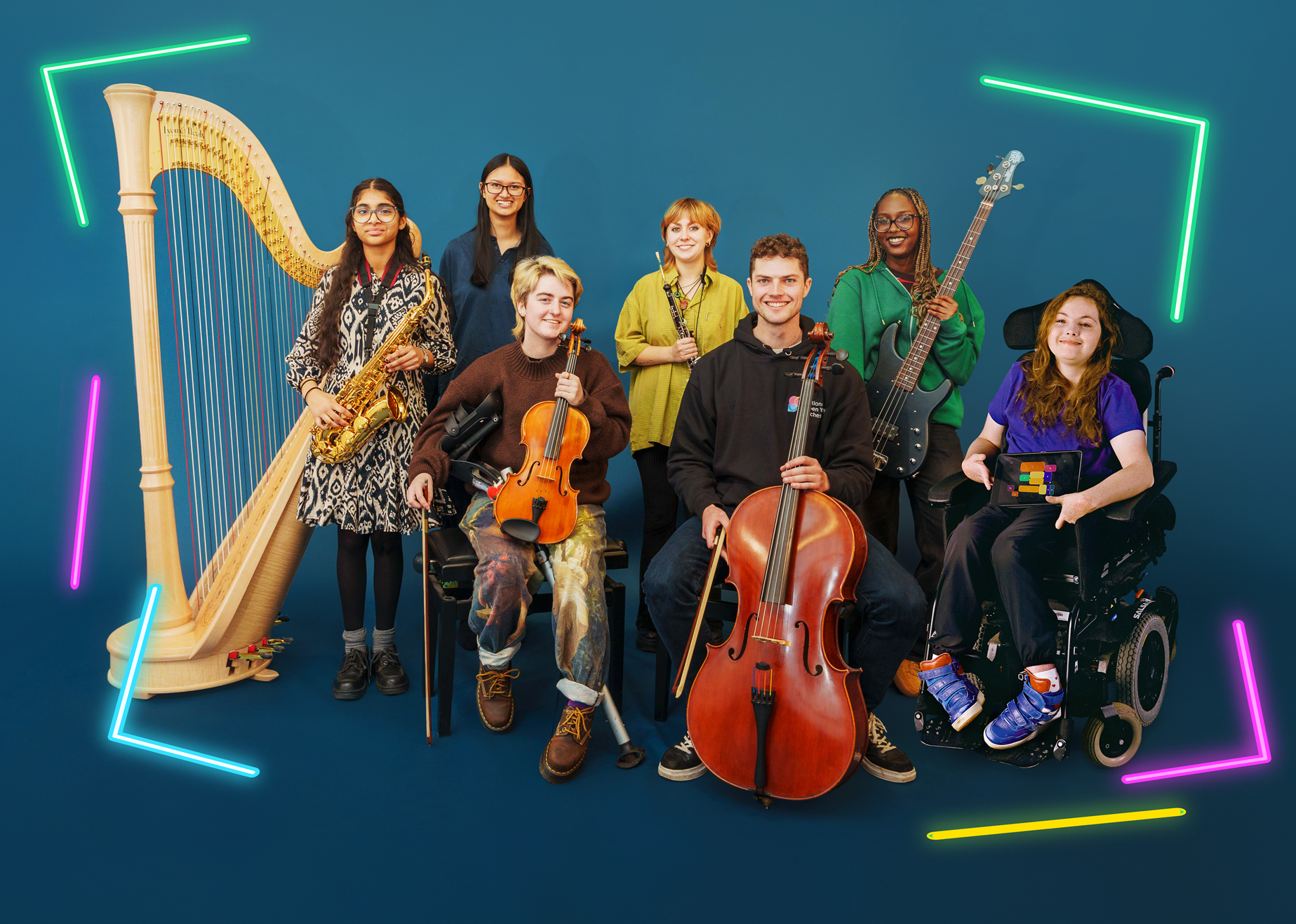 A group of seven disabled an non-disabled musicians pose with a mix of acoustic, electornic and accesible instruments.